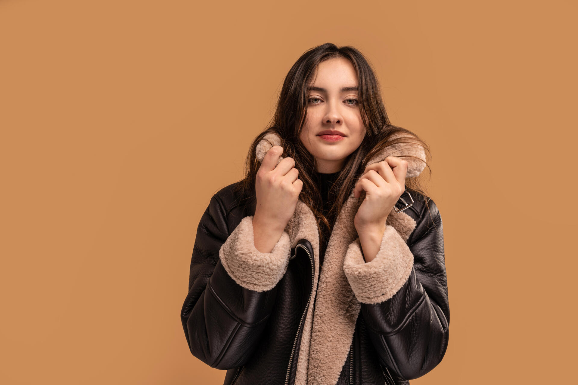 Woman wearing trendy fall fashion shearling jacket