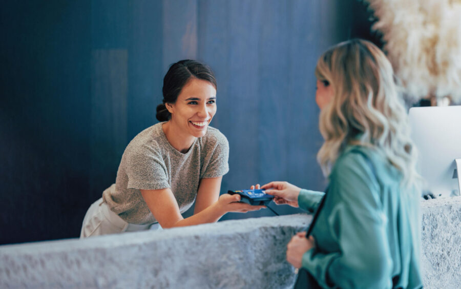 Card Payment Strategies to Boost Your Business’ Bottom Line 11 Business owner taking a card payment