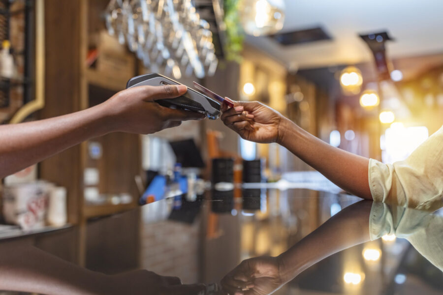 Card Payment Strategies to Boost Your Business’ Bottom Line 2 Small business owner taking a card payment