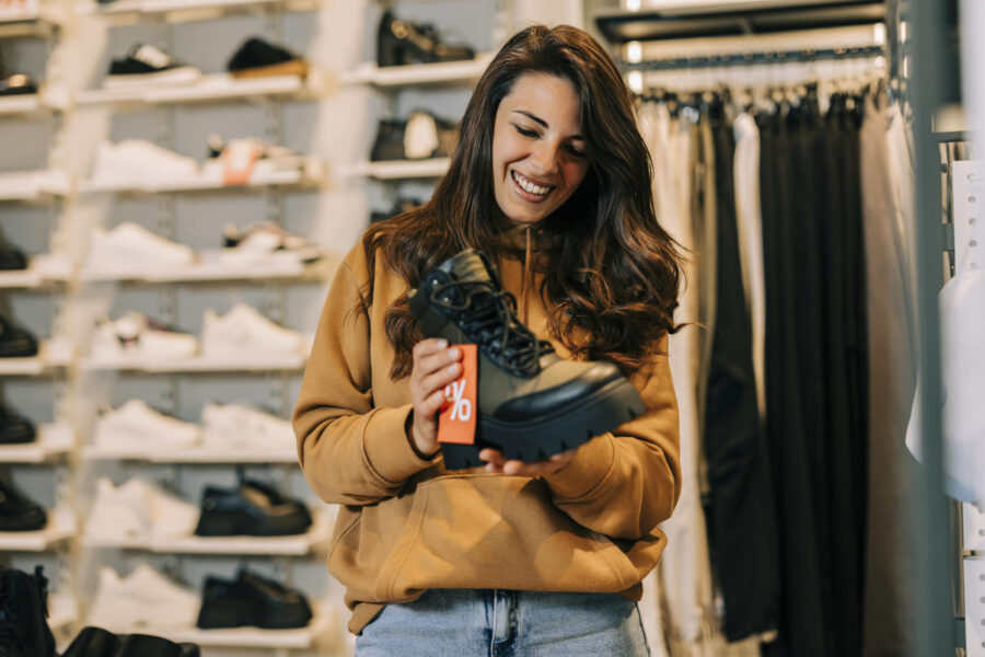 Your Guide to Shopping for Less 2 Woman shopping on a budget