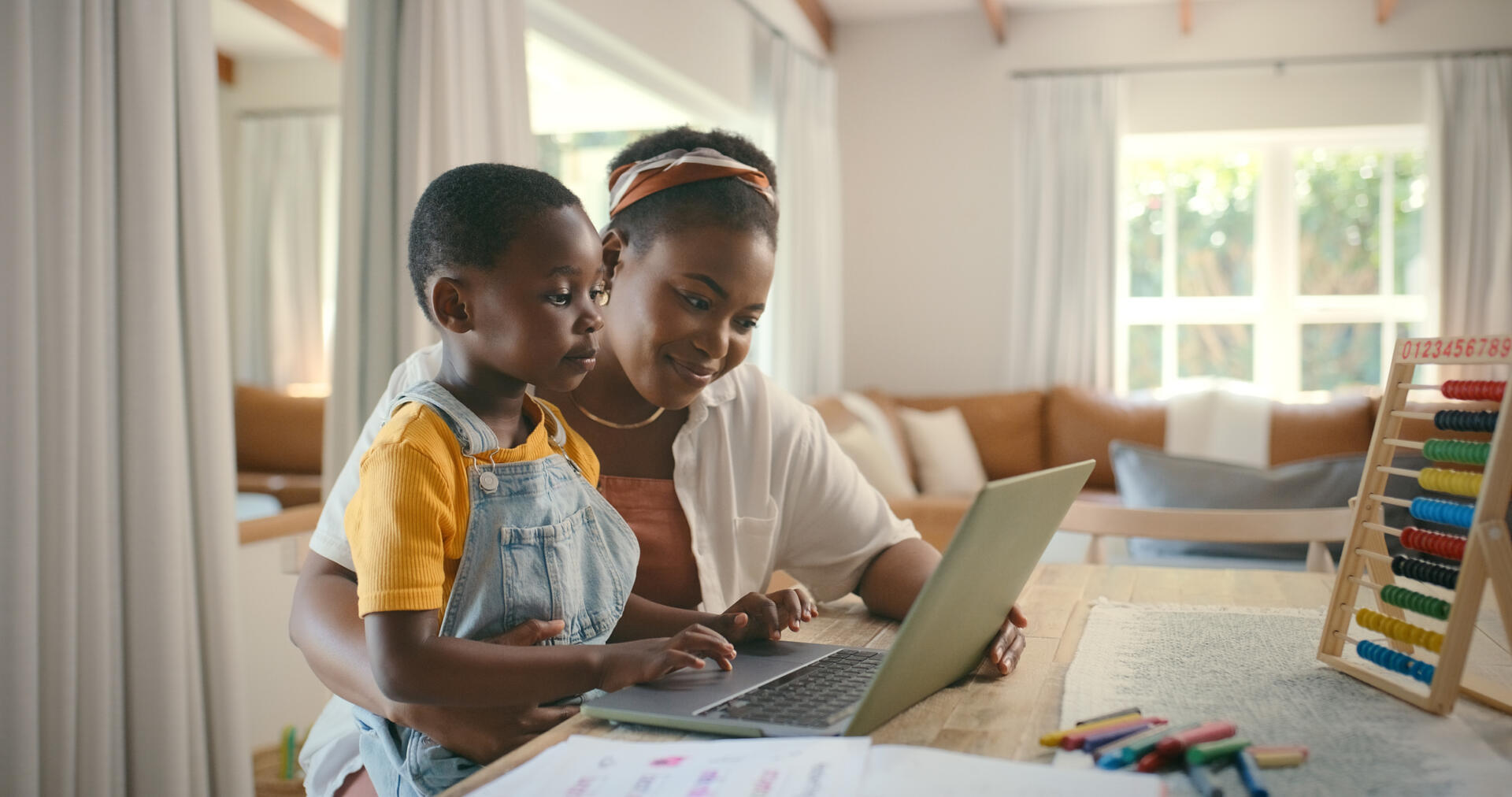 Woman and her child on a computer